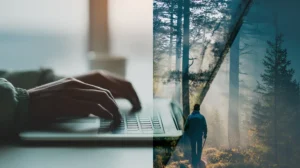 En man som sitter vid ett modernt skrivbord och arbetar fokuserat, med en suddig bakgrund av en avkopplande naturscen synlig genom ett fönster.